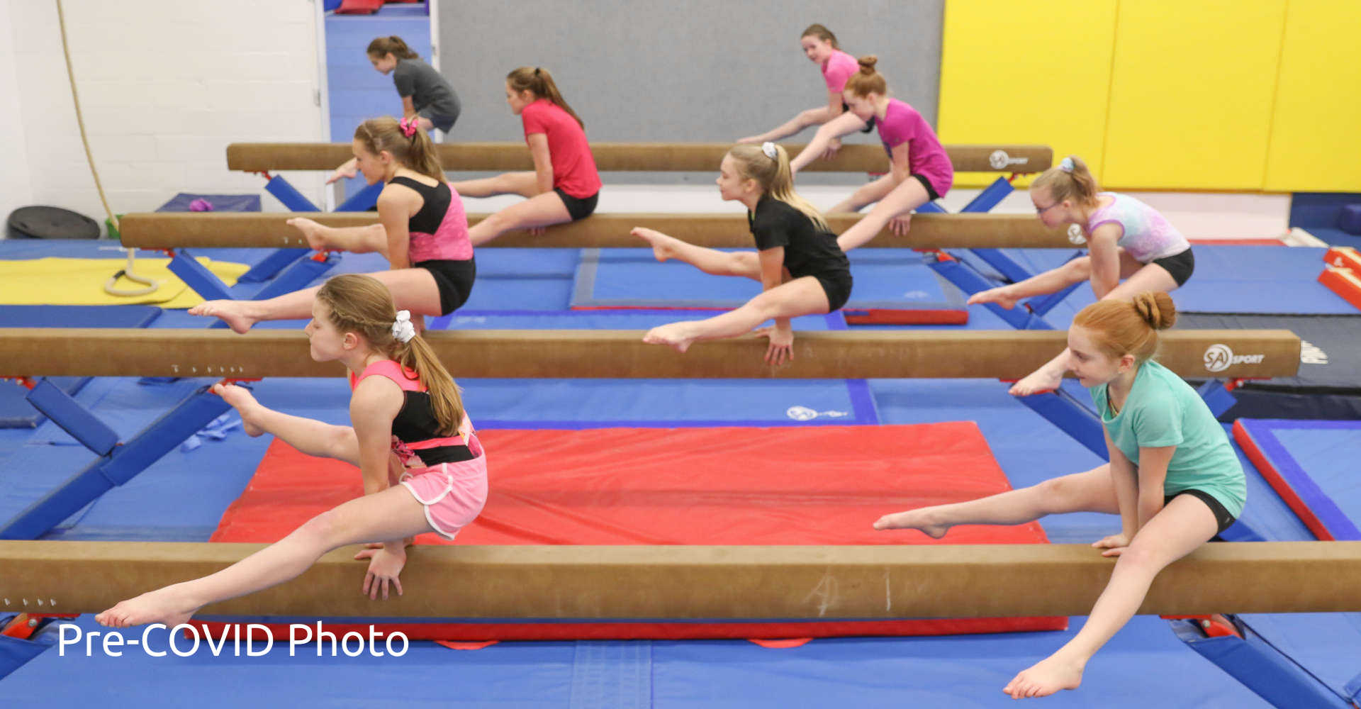 Girls training on balance beams at Gymworlds' gymnastics camp at Gymworld Adventures in Gymnastics in Northwest London, Ontario