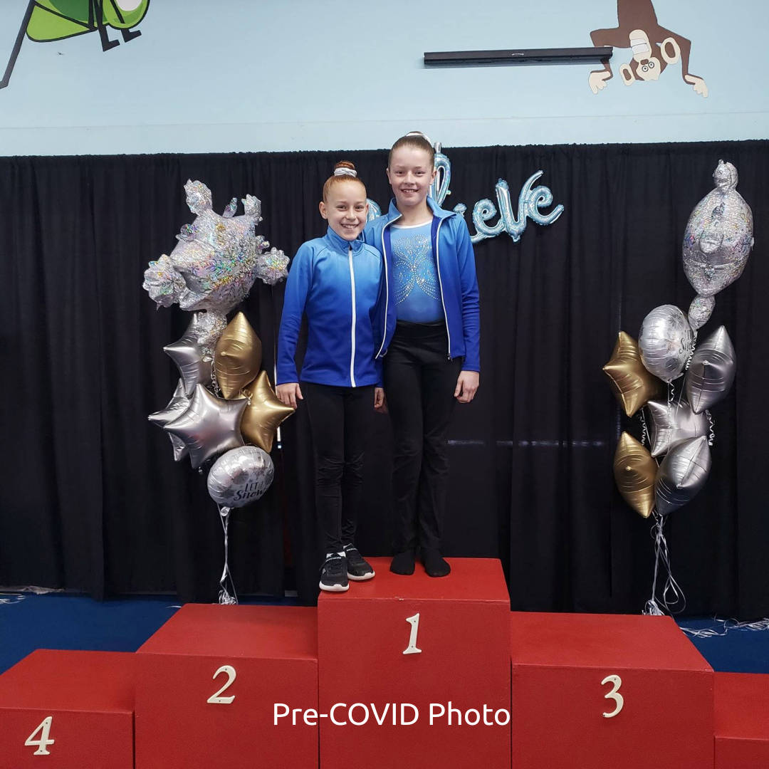 A couple of GW Elites girls on a podium.