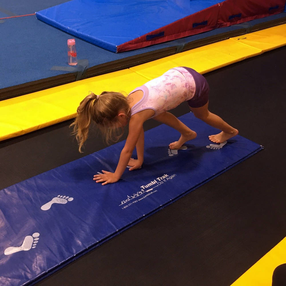 Gymworld Facility in Northwest London, professional gymnastics equipment - adjustable bars, balance beams, large spring floor, 40 ft. tumble track, 2 tumbling rods, vault table etc.